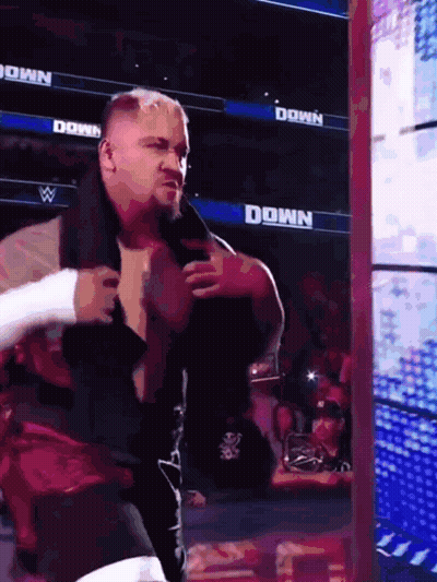 Man In Wrestling Ring With Down Sign GIF