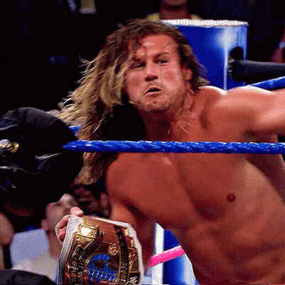 Man In Wrestling Ring With Gold World Heavyweight Champion Belt GIF