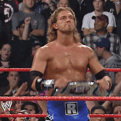 Man In Wrestling Ring With Letter R On Belt GIF