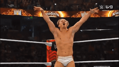 Man In Wrestling Ring With Main Event Sign GIF