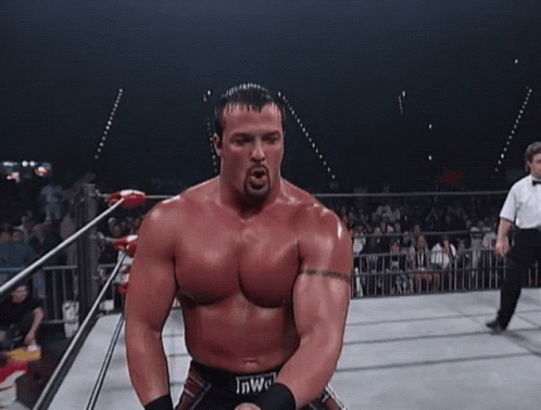 Man In Wrestling Ring With Number 7 On Pants GIF