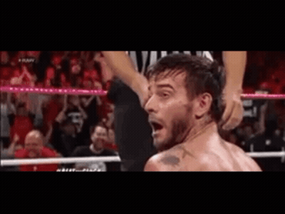Man In Wrestling Ring With Referee GIF