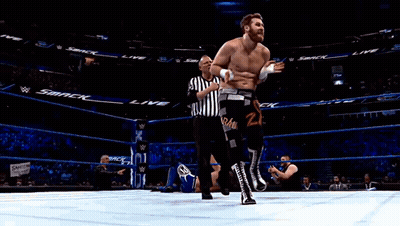 Man In Wrestling Ring With Smack On Walls GIF