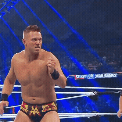 Man In Wrestling Ring With Survivor Banner GIF