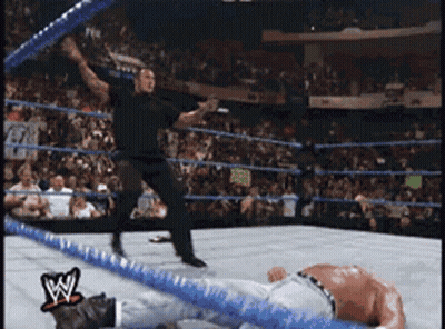 Man In Wrestling Ring With W Logo GIF