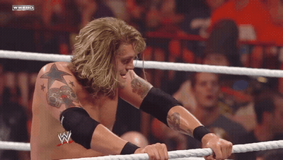Man In Wrestling Ring With W On Chest GIF