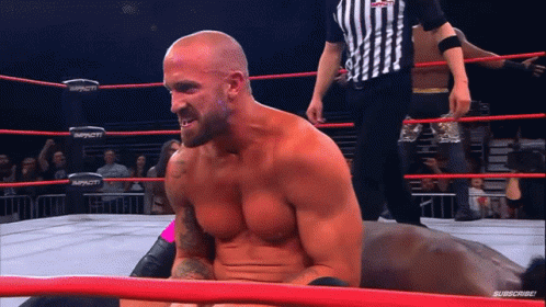 Man In Wrestling Ring With Word Impact GIF