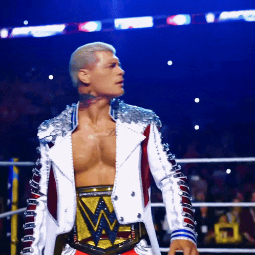 Man In Wrestling Ring With WWE Belt GIF