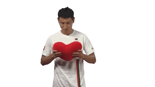 Man In Wwk Shirt Holding Red Heart Sticker