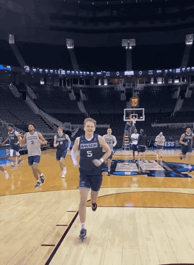 Man In Xavier Jersey Running On Court GIF