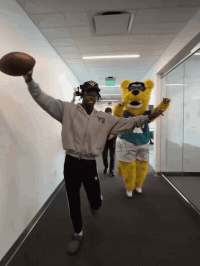 Man In Y3 Jacket Holding Football GIF