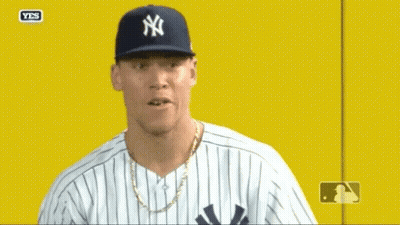 Man In Yankees Hat And Striped Shirt GIF