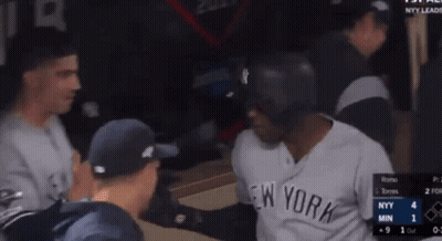 Man In Yankees Jersey Talking To Another Man GIF