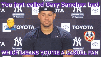 Man In Yankees Shirt In Front Of Toyota Ad GIF