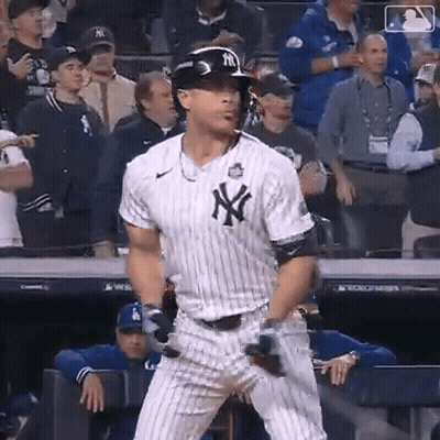 Man In Yankees Uniform Holding Bat GIF
