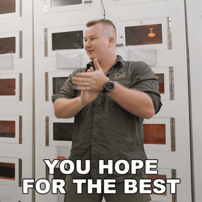 Man In Yankees Uniform Squatting With Bat GIF