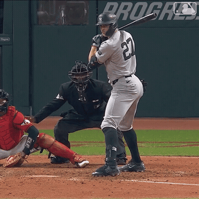 Man In Yankees Uniform Swinging Bat GIF
