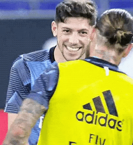 Man In Yellow Adidas Shirt Hugging Woman GIF