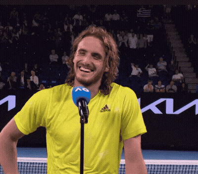 Man In Yellow Adidas Shirt Laughing At Microphone GIF