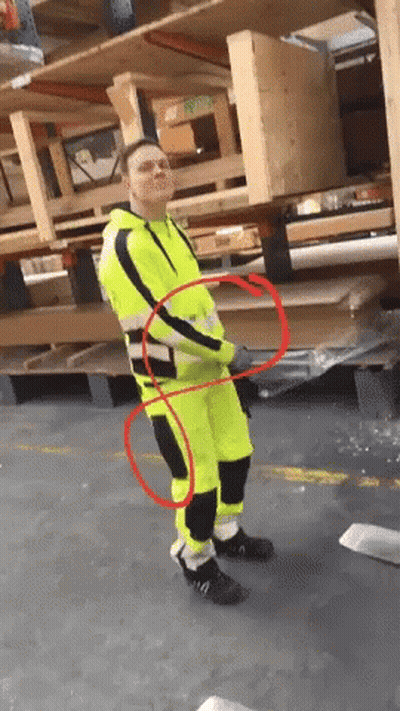 Man In Yellow And Black Safety Suit By Wooden Pallets GIF