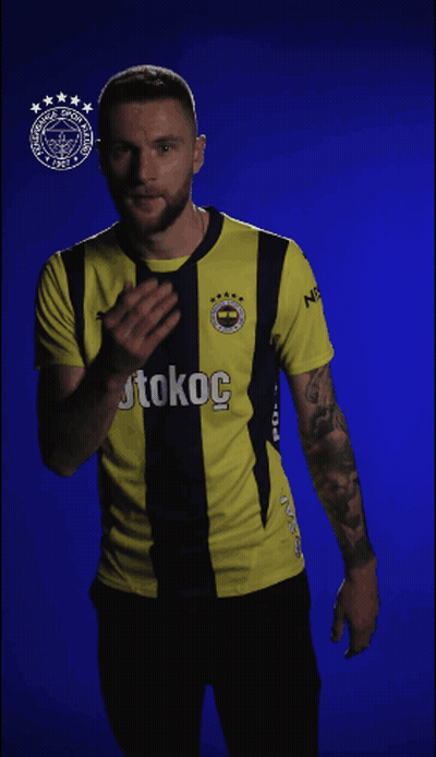 Man In Yellow And Black Shirt With Kokoc GIF