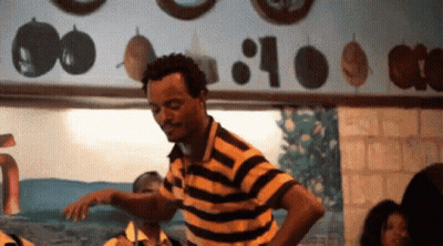 Man In Yellow And Black Striped Shirt Dancing GIF