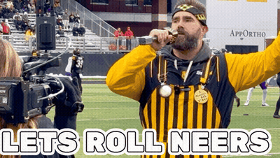 Man In Yellow And Black Striped Shirt Sings Let's Roll Neers GIF