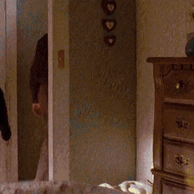 Man In Yellow And Black Striped Shirt Using Computer GIF