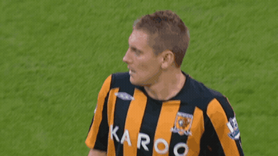 Man In Yellow And Black Striped Shirt With Karoo GIF