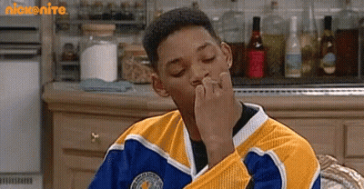 Man In Yellow And Blue Jersey Sitting Eyes Closed GIF