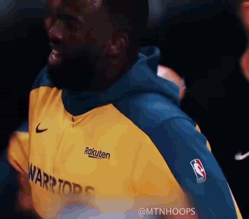 Man In Yellow And Blue Warriors Sweatshirt GIF