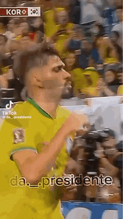 Man In Yellow And Green Jersey Dancing Before Crowd GIF