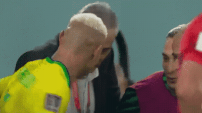 Man In Yellow And Green Jersey Talking GIF