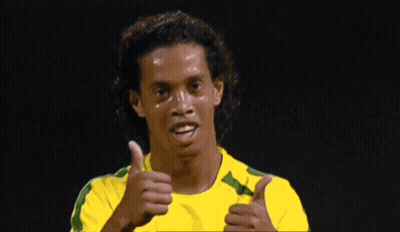 Man In Yellow And Green Shirt Looking Down GIF