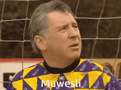 Man In Yellow And Purple Shirt Saying Muwesi GIF