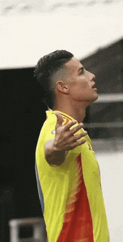 Man In Yellow And Red Shirt Looking Up GIF