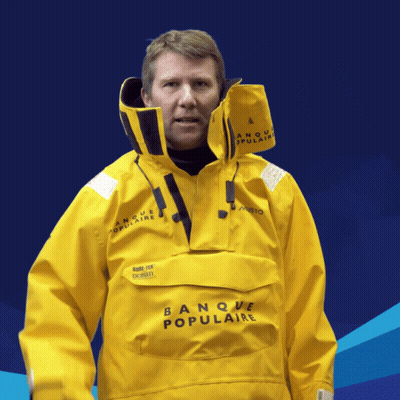 Man In Yellow Banque Populaire Jacket Blue Background GIF