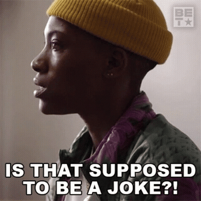 Man In Yellow Beanie And Green Jacket Says Is That Supposed To Be A Joke GIF