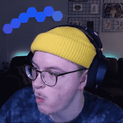 Man In Yellow Beanie And Headphones Looking Left GIF