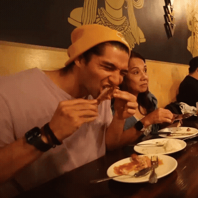 Man In Yellow Beanie Eating Food GIF