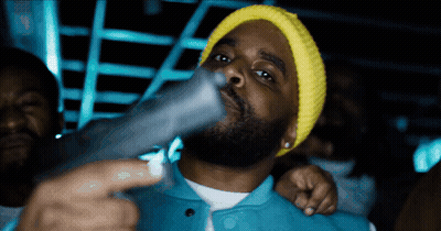 Man In Yellow Beanie Holding Gun GIF