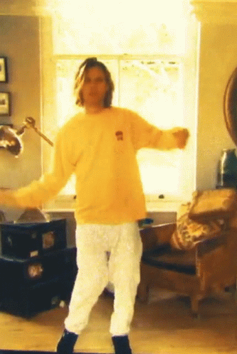 Man In Yellow Bear Shirt Dancing In Living Room GIF