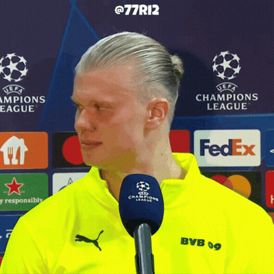 Man In Yellow BVB Shirt Talking Into Microphone GIF