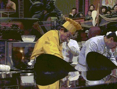 Man In Yellow Chef Hat Before Crowd GIF