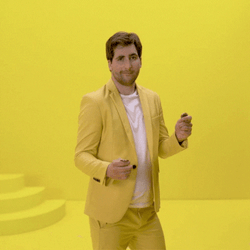 Man In Yellow Coin Flip GIF