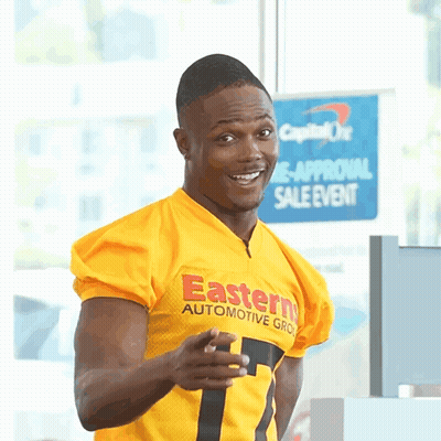 Man In Yellow Eastern Automotive Group Jersey Pointing At Camera GIF