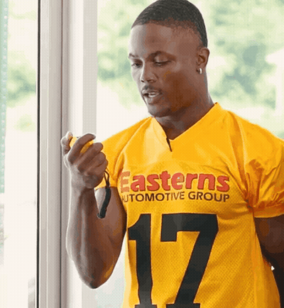 Man In Yellow Eastern Automotive Group Jersey Pointing At Camera GIF