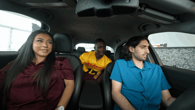 Man In Yellow Eastern Jersey In Back Seat Of Car GIF