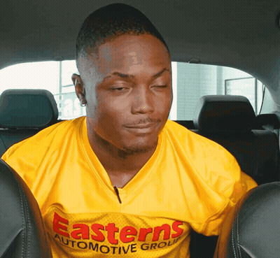 Man In Yellow Easterns Automotive Group Shirt GIF