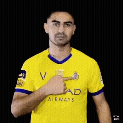Man In Yellow Etihad Airways Jersey Waving GIF